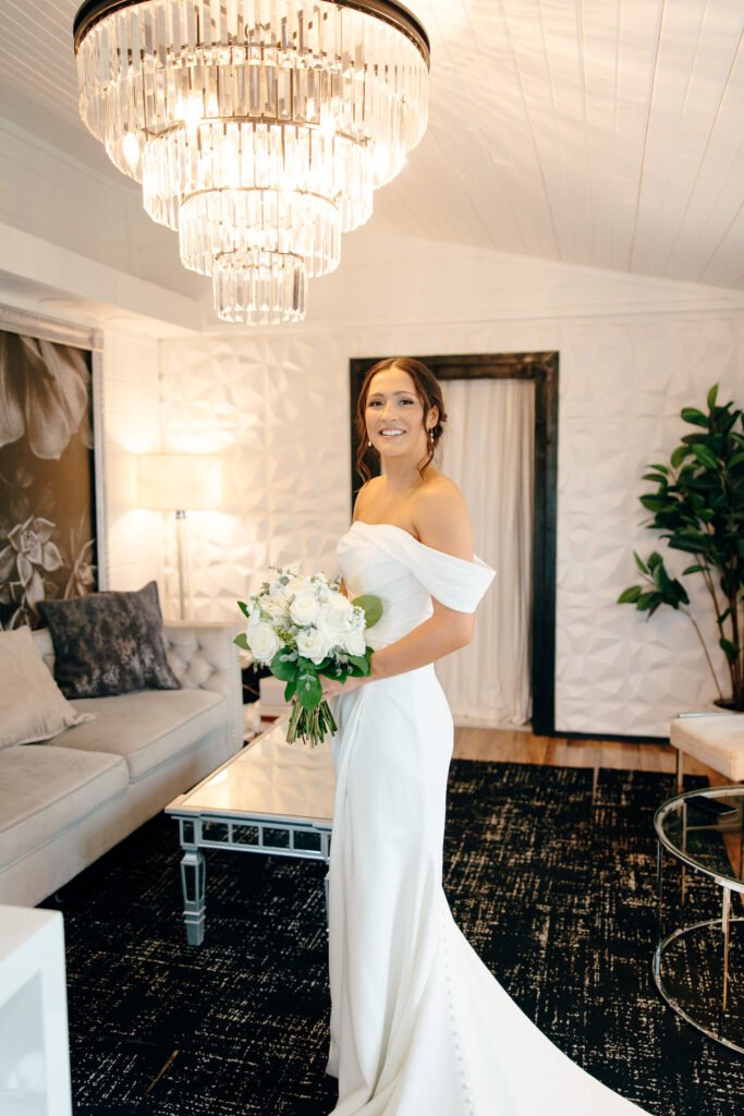 Groom in a classic black tuxedo for a luxury Des Moines wedding.