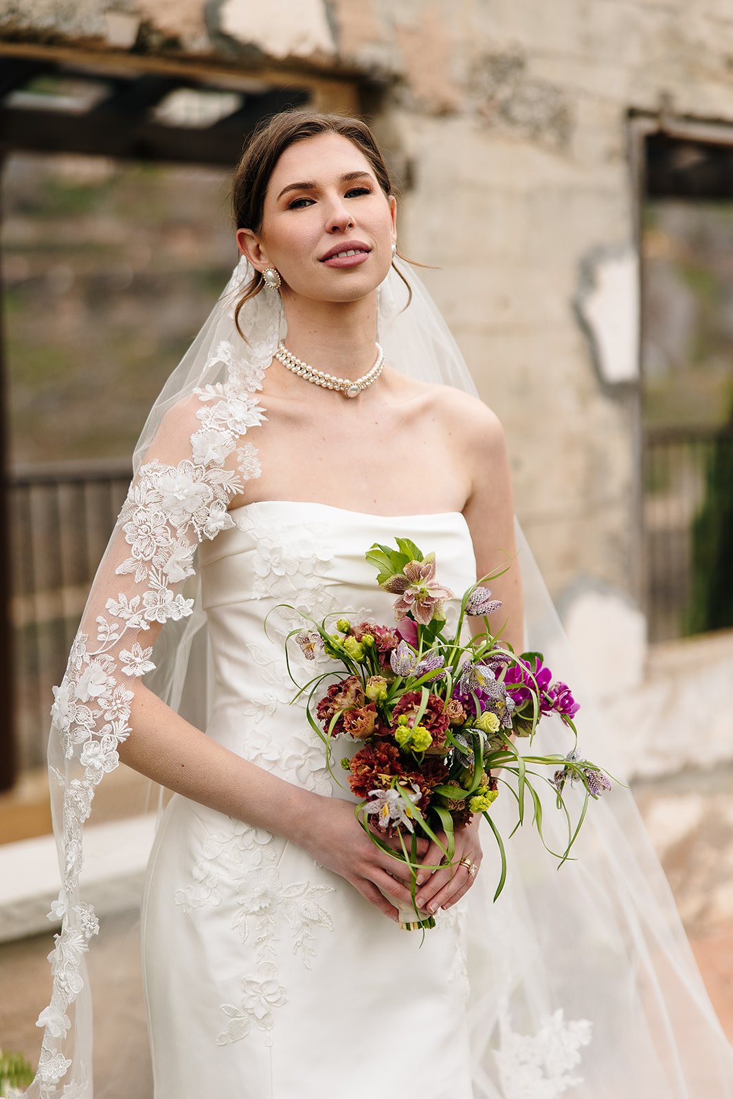 Bride portrait with a wildflower bouquet at an editorial wedding venue