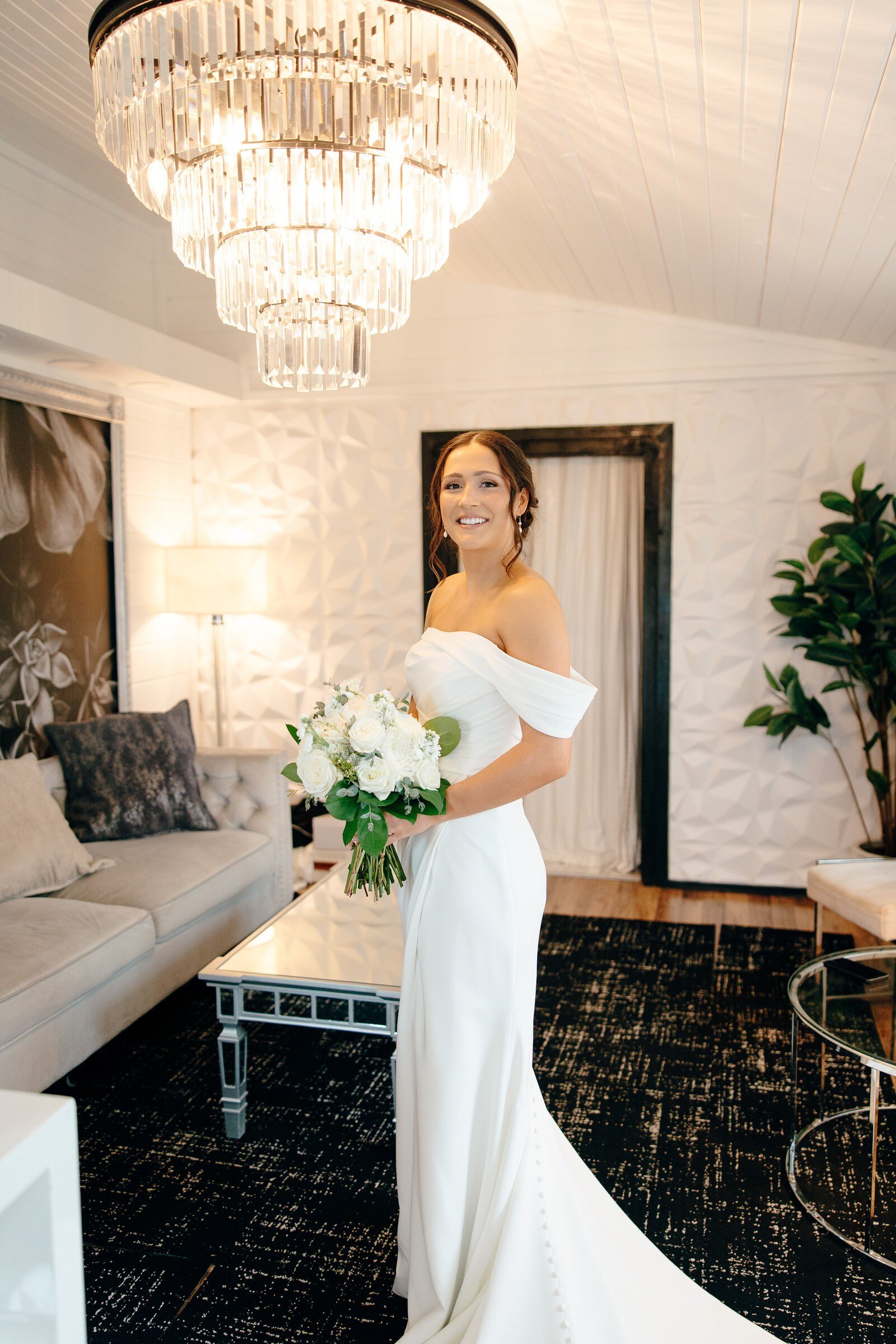 Couple portrait in a sunlit arched hallway